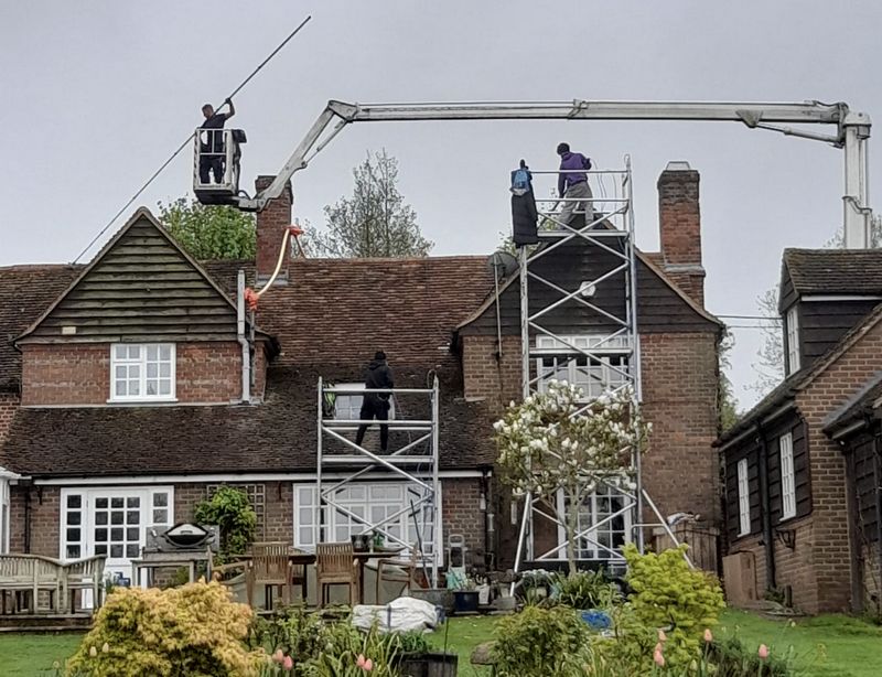 The Moss Cleaners using cherry picker and scaffolding to clean roof safely and professionally in 29 St James' Rd, Surbiton KT6 4QL, UK, 29 St James' Rd, Surbiton KT6 4QL, UK